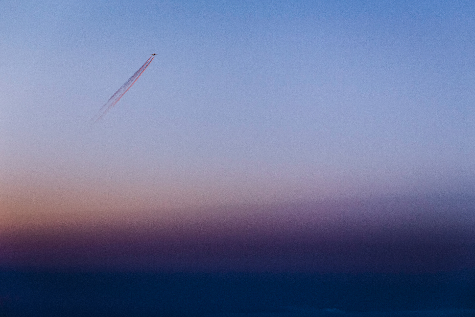 Sunset sky with contrail